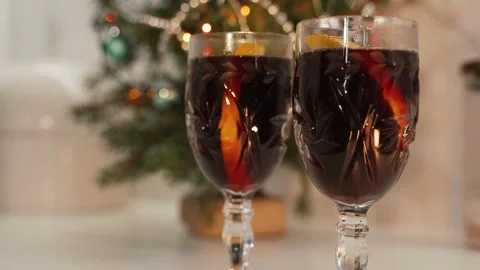 Fragrant mulled wine on the background of a Christmas tree Видео 255554785