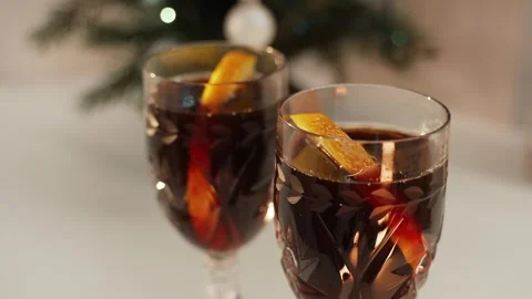 Fragrant mulled wine on the background of a Christmas tree Stock Footage 255704884