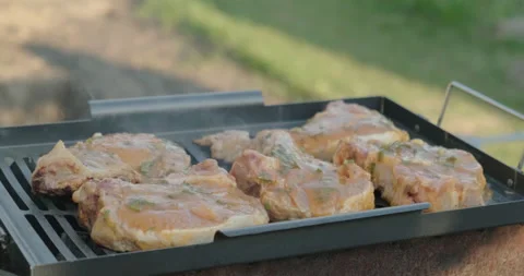 Fragrant Piece of Meat, Fried Until Golden Brown, Chef Turns Juicy Steak on BBQ Stock Footage 130322024