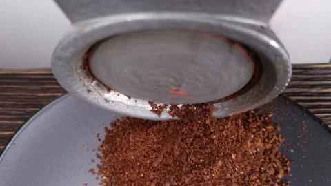 Fragrant roasted coffee beans are grinded by an old vintage manual coffee Video stock 150827416