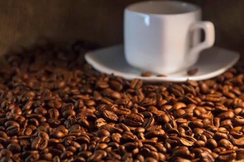 Fragrant roasted coffee beans brown and cup Stock Photos