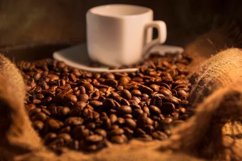 Fragrant roasted coffee beans brown and cup Stock Photos