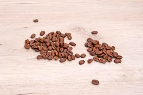 Fragrant roasted coffee beans chaotically scattered Stock Photos