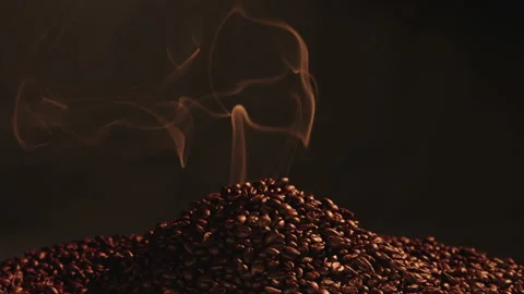 Fragrant roasted coffee beans with smoke coming from coffee beans. Stock Footage 145273917