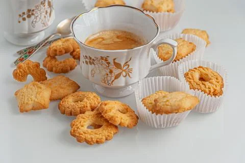 Fragrant shortbread biscuits and coffee in vintage cups Stock Photos