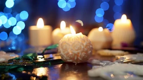 Fragrant soy candles bloom in front of Christmas tree with their handmade toys Stock Footage 259182829