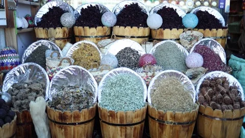 Fragrant spices and dried herbs packed in wooden barrels burst with texture and  Stock Footage 310535688