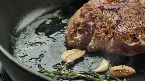 Fragrant steam rises over the appetizing steak Stock Footage 233845871