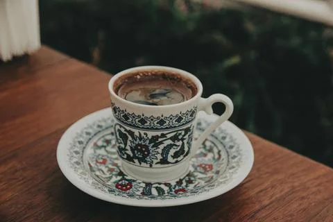 Fragrant Turkish coffee in a traditional patterned porcelain small cup Stock Photos