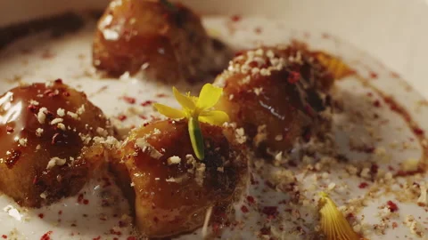 Fragrant walnut grated on top of delicate dessert with fried bananas Stock-Footage 154148843