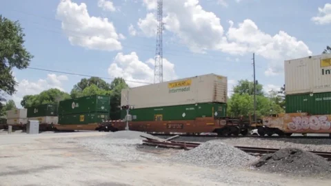 Fraight Train Passing through Rural Georgia - wide shot Stock Footage 83058363