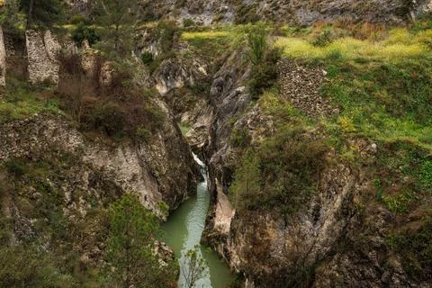 Frainos River between cliff rocks on the Salt del Moli route, Benilloba, Spain Stock Photos