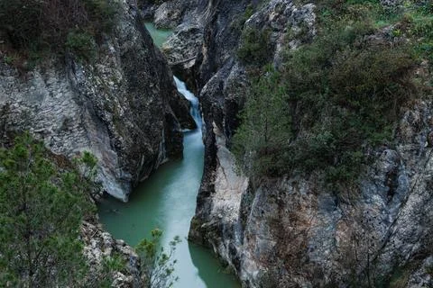 Frainos River between cliff rocks on the Salt del Moli route, Benilloba, Spain Фото