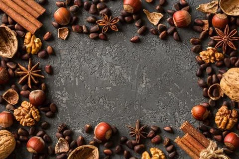 Frame of assorted nuts over  dark concrete Stock Photos