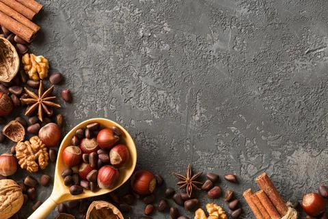 Frame of assorted nuts over  dark concrete. Stock Photos