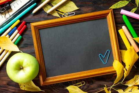 Frame Background Back to school. Table with autumn leaves, apple. Stock Photos
