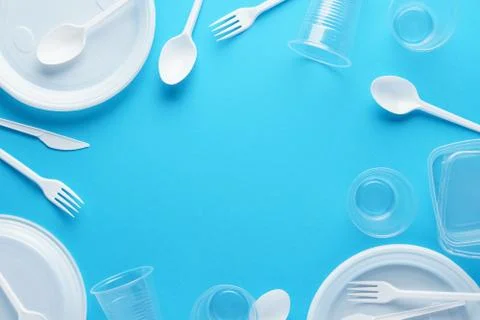 Frame background made of white plastic disposable tableware. Stock Photos