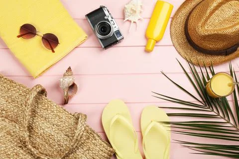 Frame of beach objects on pink wooden background, flat lay. Space for text 写真素材