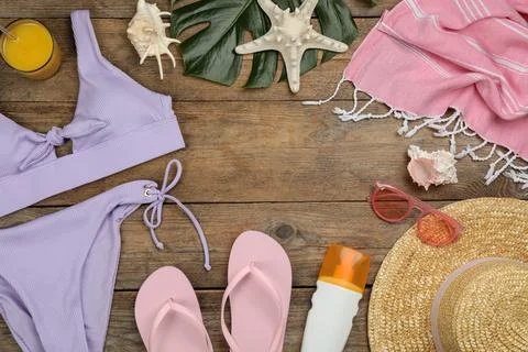 Frame of beach objects on wooden background, flat lay. Space for text Stock Photos