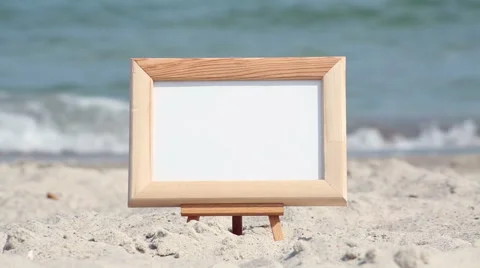 Frame on the beach with sea in background Stock Footage 50016294