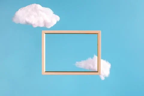 Frame on blue background with abstract clouds Stock Photos