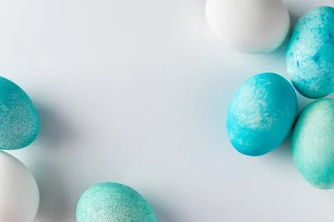 Frame of blue easter eggs on a light background. Stock Photos