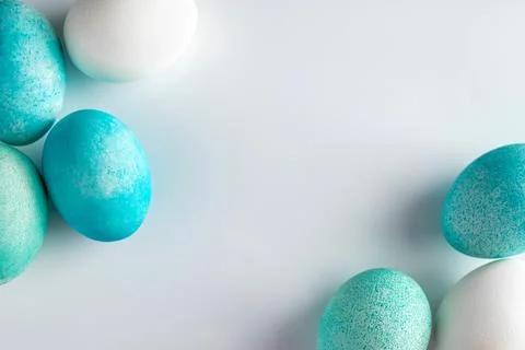Frame of blue easter eggs on a light background. Stock Photos