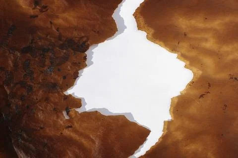 Frame brown torn baking paper and whte background Stock Photos