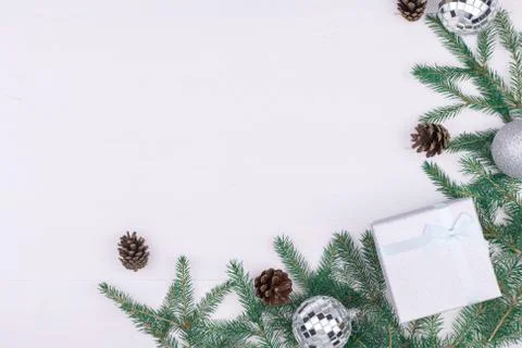 Frame of Christmas decorations on a white background,tree branches, cones, gi Stock Photos