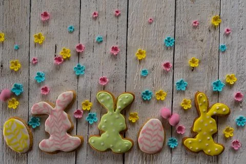 Frame from cookies for Easter. Bunny and eggs decorated with icing dry on whi Stock Photos