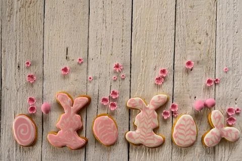 Frame from cookies for Easter. Bunny and eggs decorated with icing dry on whi Stock Photos