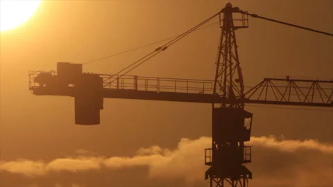 Frame of crane in backlight of sunset sky Stock Footage 133271435