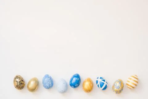 Frame of Easter decorated eggs isolated on white background. Minimal easter 스톡 사진