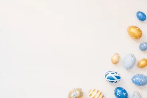 Frame of Easter decorated eggs isolated on white background. Minimal easter 스톡 사진