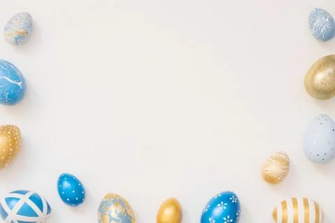 Frame of Easter decorated eggs isolated on white background. Minimal easter 스톡 사진