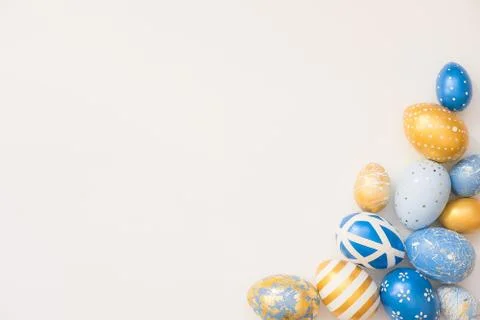 Frame of Easter decorated eggs isolated on white background. Minimal easter 스톡 사진