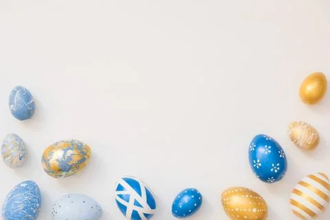 Frame of Easter decorated eggs isolated on white background. Minimal easter 스톡 사진