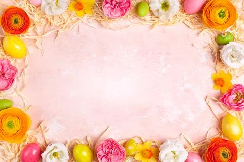 Frame with easter eggs and spring flowers Stock Photos