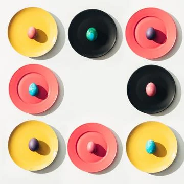 Frame easter eggs colorful plates Stock Photos