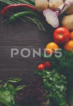 Frame of fresh vegetables on wooden background with copy space Stock Photos