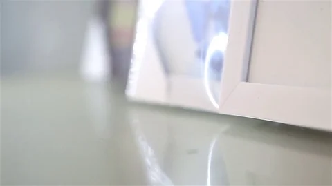 Frame on a glass shelf Video stock 80924356