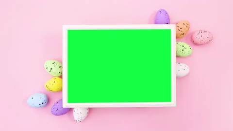 Frame with green screen for Easter with colored eggs. Stop motion Video stock 148780280