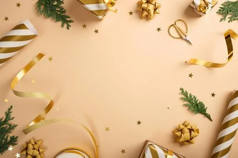 Frame of items for gift wrapping. Striped paper, golden ribbons, cedar spruce Stock Photos