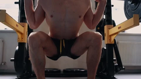 The frame of the legs while performing weights with the weight bar in the back Stock Footage 156479640