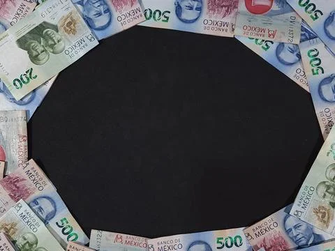 Frame made with assorted Mexican banknotes stacked on a black background Stock Photos