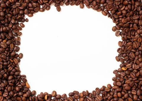Frame made of coffee beans. Pattern from roasted coffee beans. Stock Photos