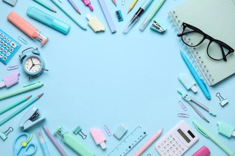 Frame made of different school stationery supplies with alarm clock and eyegl Stock Photos
