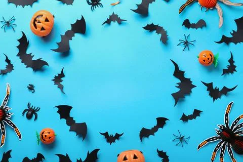 Frame made with Halloween decor elements on light blue background, flat lay.  写真素材