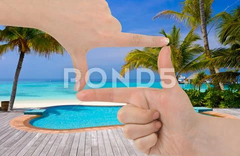 Frame made of hands and beach landscape Stock Photos