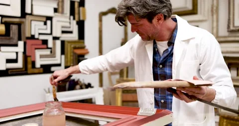 Frame maker gilding picture frame Video stock 223336882